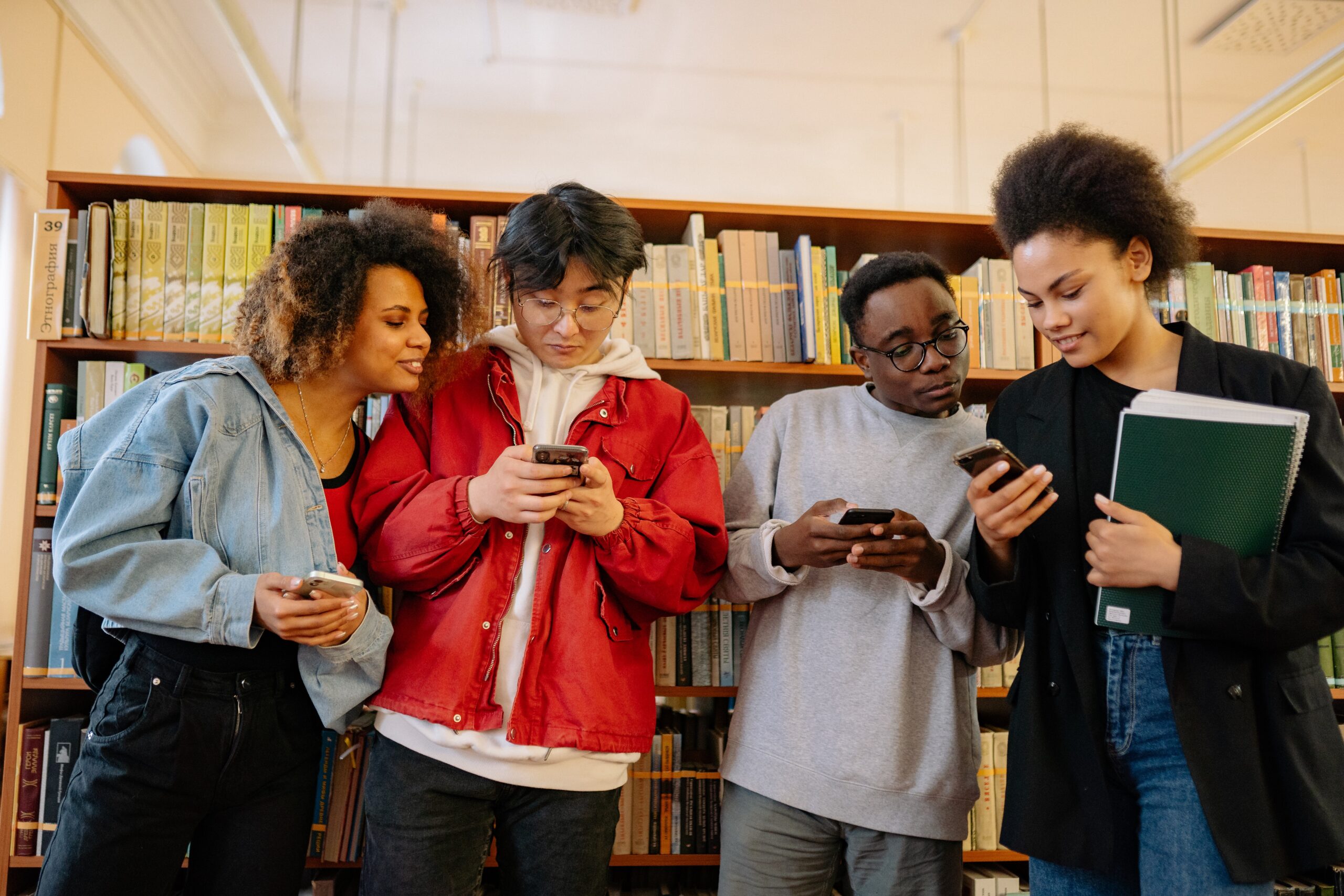 A group of people using smartphones