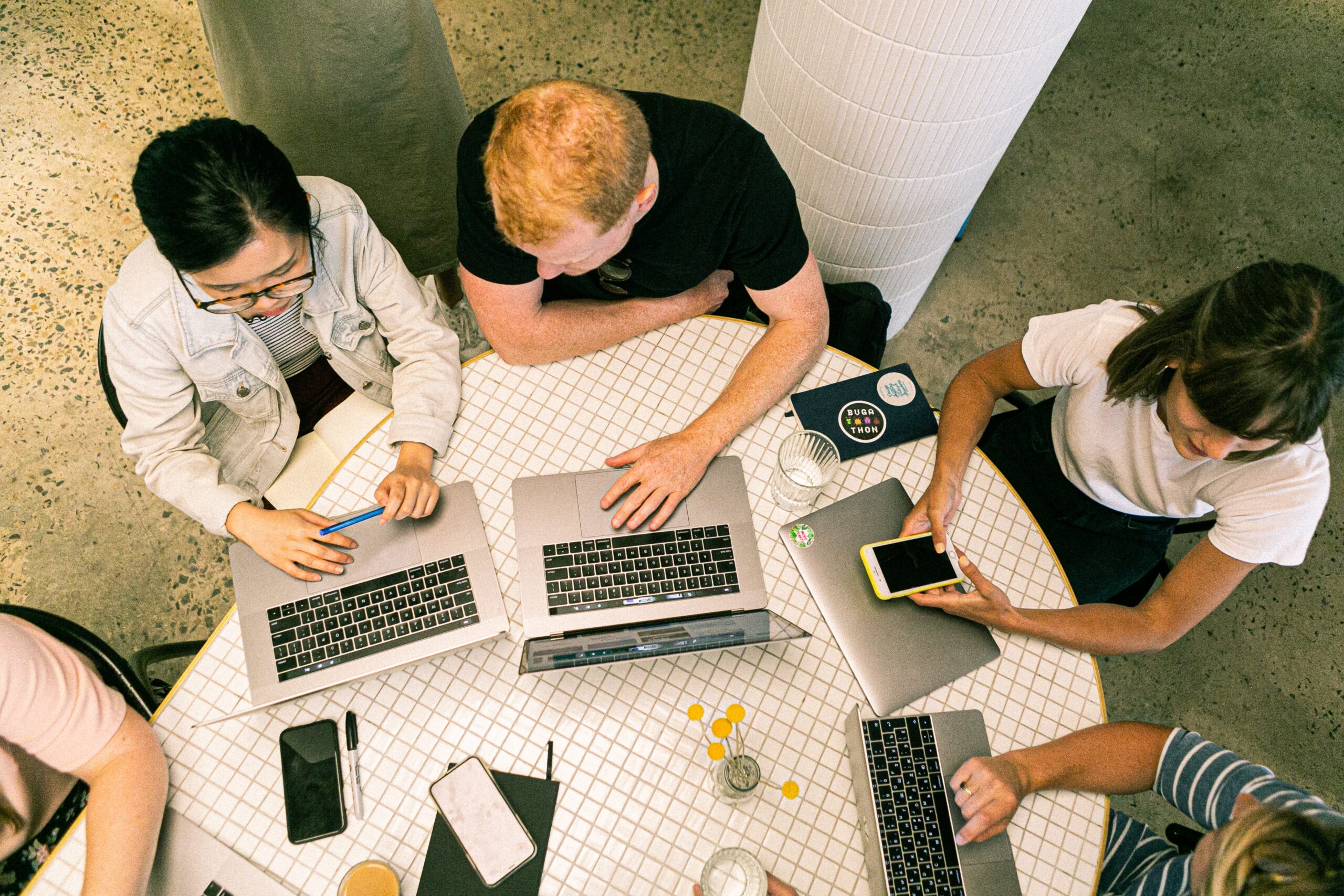 People in a meeting using laptops