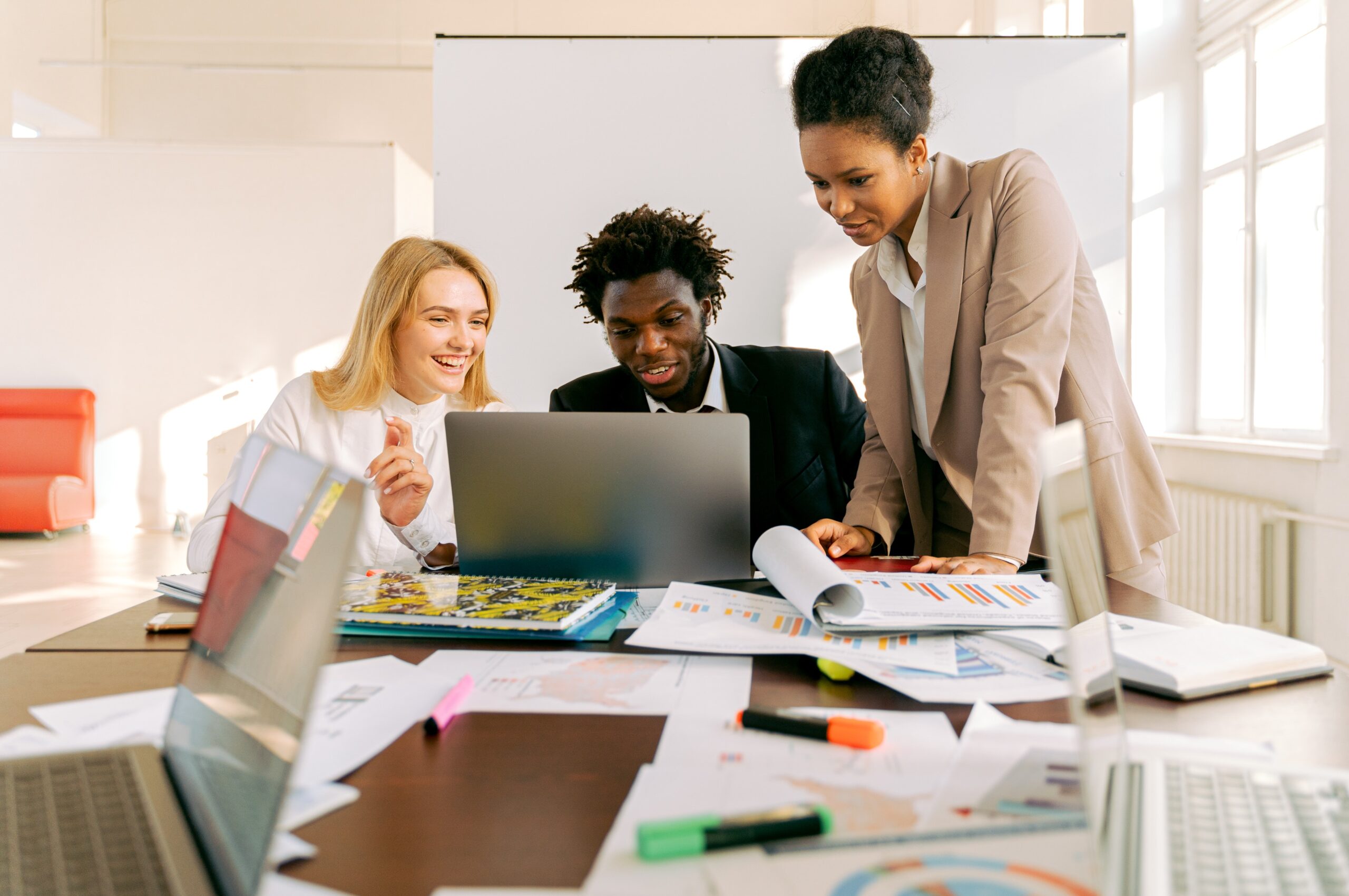 Team working on a laptop in a meeting