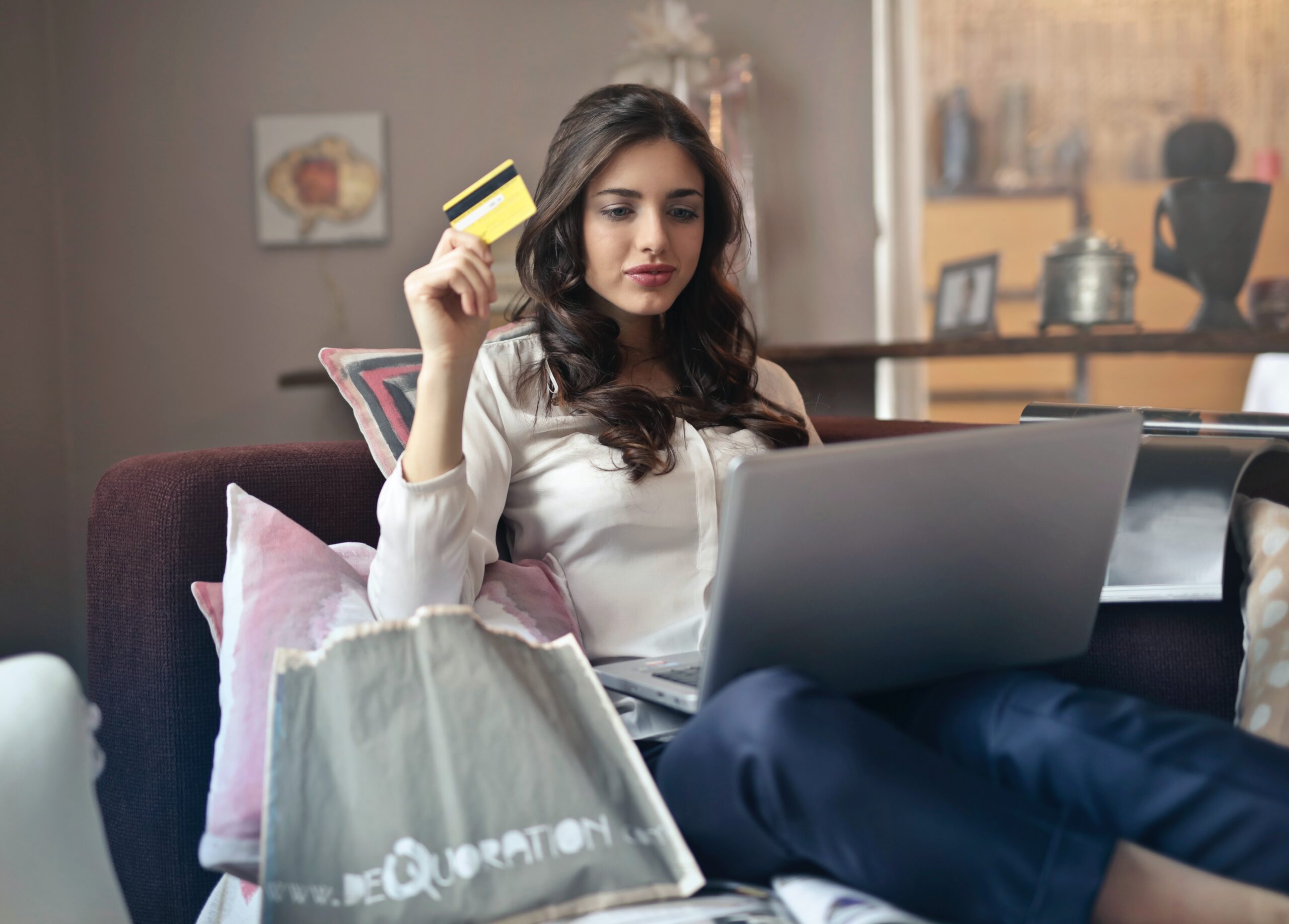 Woman shopping online using laptop