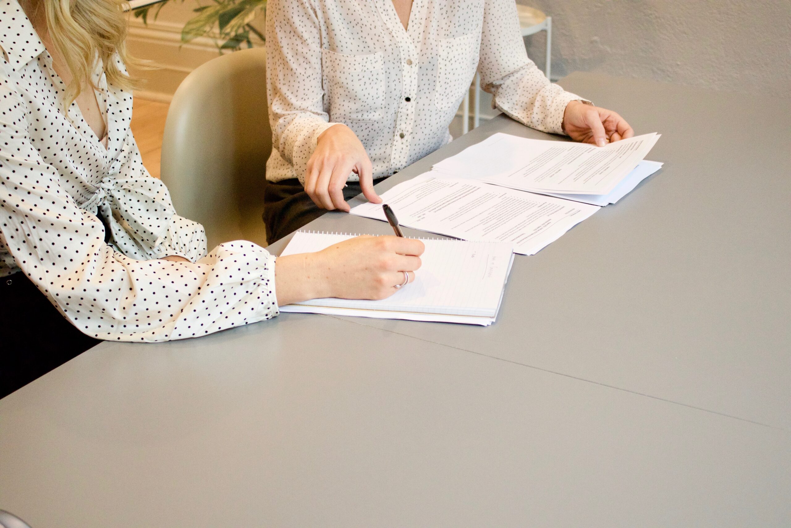 Woman signing a document