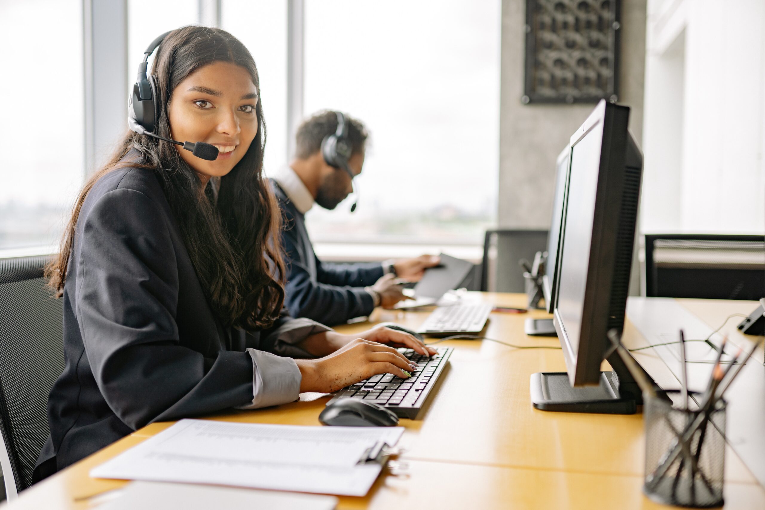 A smiling woman working at a call centre